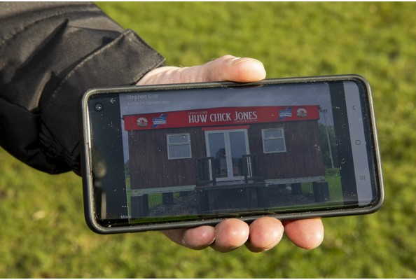Corwen football clubhouse mobile Huw Chick Jones sign2